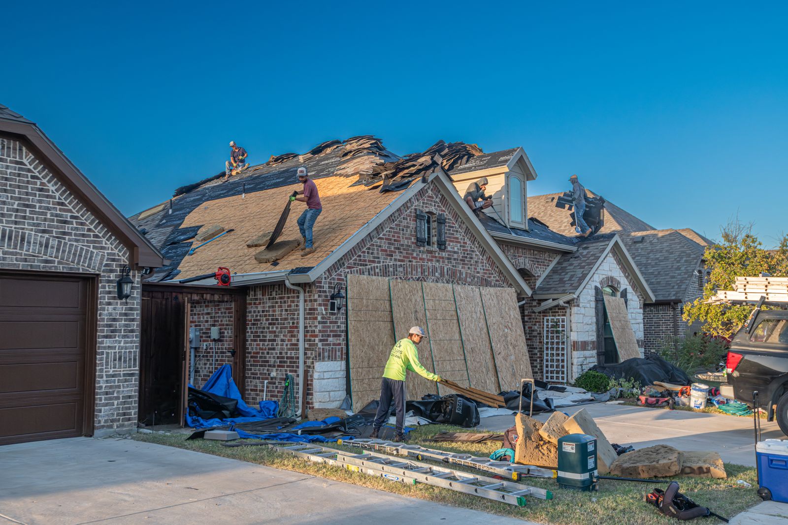 A roofing crew replacing a roof