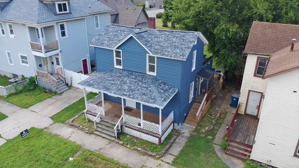 Completed Eagle Star roof on a two-storey home with a wraparound porch