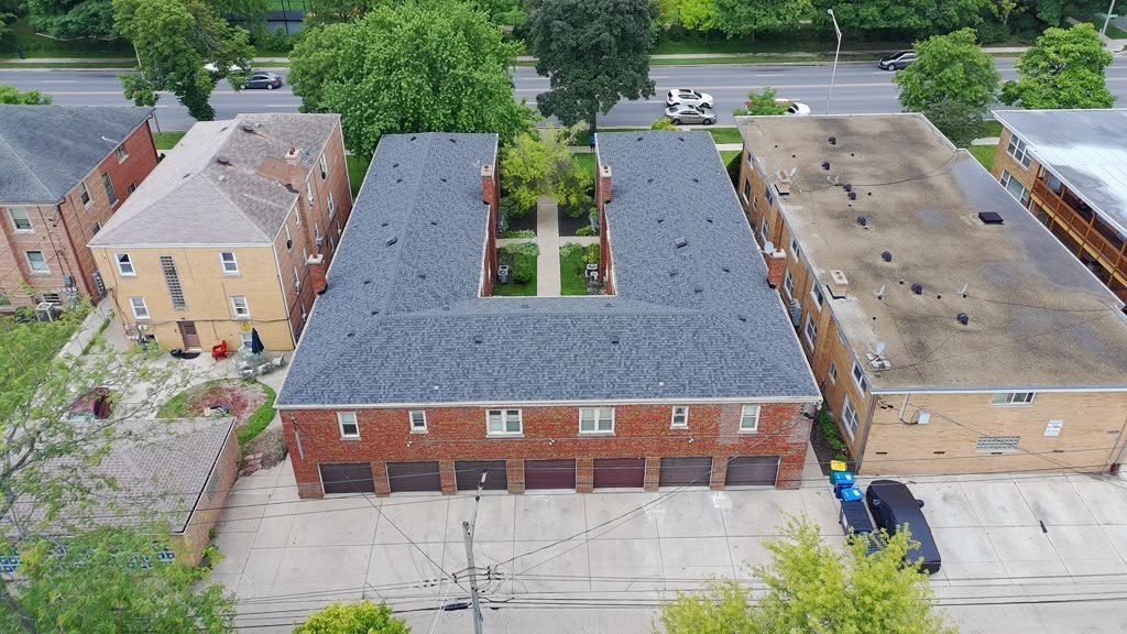 Completed Eagle Star roof on a brick multi-unit building