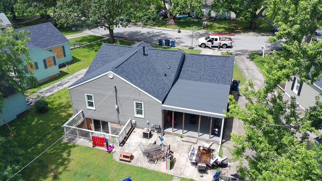 Eagle Star roof project on a grey home with the crew truck at the curb