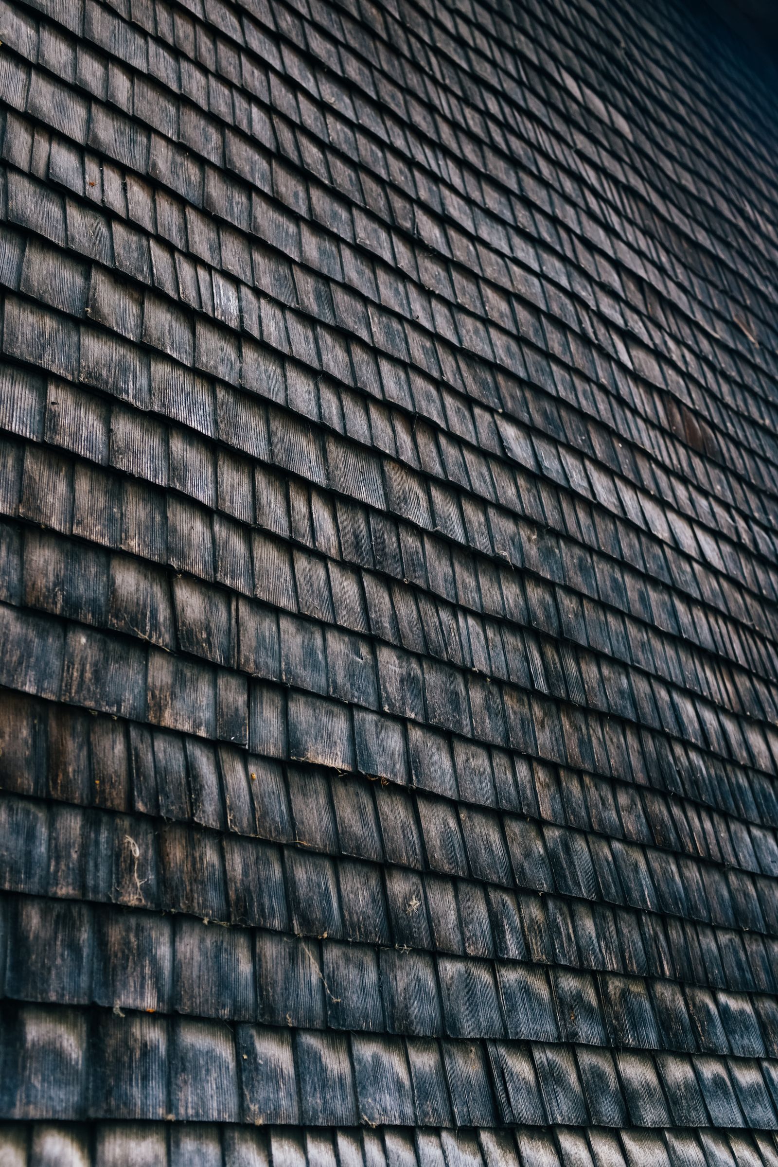 Representative Pexels stock photo of weathered roof tiles; not inspection evidence or an Eagle Star project